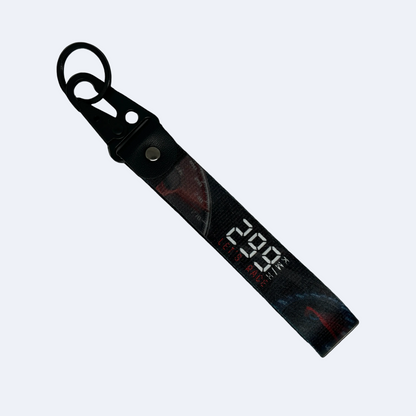 Black 299 KM/H Let’s Race key tag with a speedometer design – Motorev JDM performance car keychain accessory