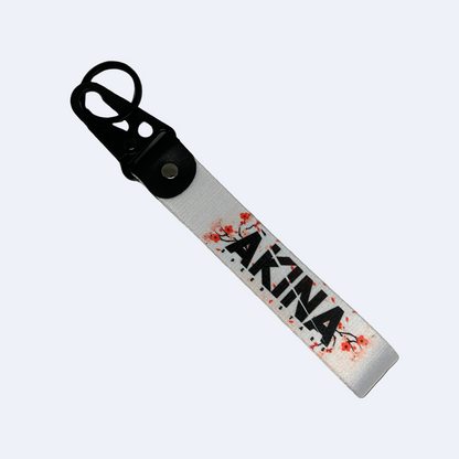 Motorev AKINA Speed Stars car key tag, a zinc alloy and nylon keyring featuring the iconic cherry blossom design, scratch resistant and built for JDM and anime car culture enthusiasts UK