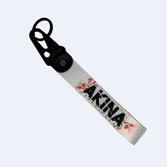 Motorev AKINA Speed Stars car key tag, a zinc alloy and nylon keyring featuring the iconic cherry blossom design, scratch resistant and built for JDM and anime car culture enthusiasts UK