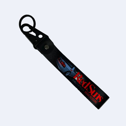 Motorev Akagi RedSuns car key tag, a zinc alloy and nylon JDM keyring featuring the iconic Initial D mountain pass racing crew design, scratch resistant and built for JDM and anime car culture enthusiasts UK