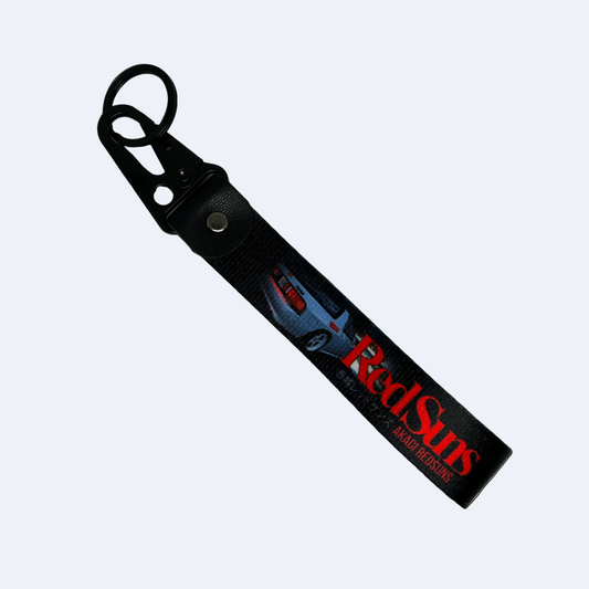 Motorev Akagi RedSuns car key tag, a zinc alloy and nylon JDM keyring featuring the iconic Initial D mountain pass racing crew design, scratch resistant and built for JDM and anime car culture enthusiasts UK