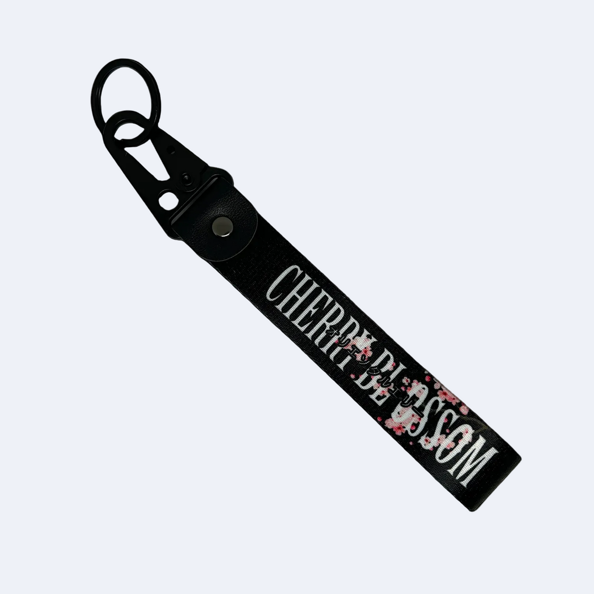 Black key tag with a floral cherry blossom design and cherry clossom in text – Motorev car accessory