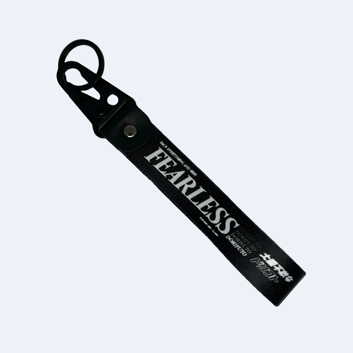 Black Fearless key tag with white text and drift design – Motorev JDM car keychain accessory