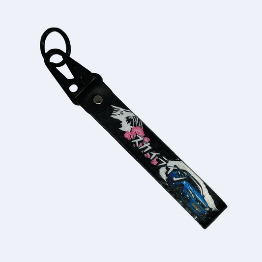 Black key tag with Mount Fuji, cherry blossom and a Nissan GTR, also including Japanese text – Motorev JDM car accessory