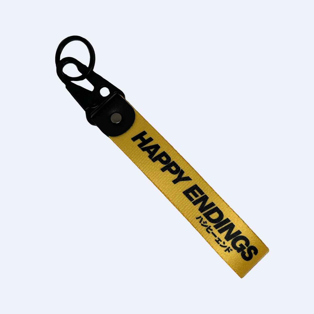 Yellow key tag with Happy Endings branding and Japanese text – Motorev car accessory