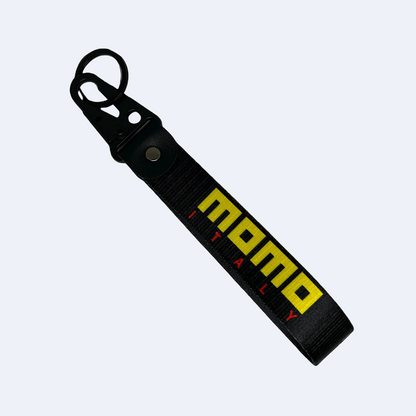 Black key tag with MOMO branding in yellow – Motorev JDM car accessory