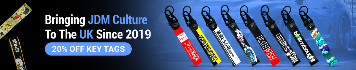 Motorev JDM car key tags homepage banner on dark background showcasing a collection of wrist strap keyrings including Osaka Racing Team, Life's Too Short, Death Wish and Cherry Blossom designs, UK automotive accessories since 2019