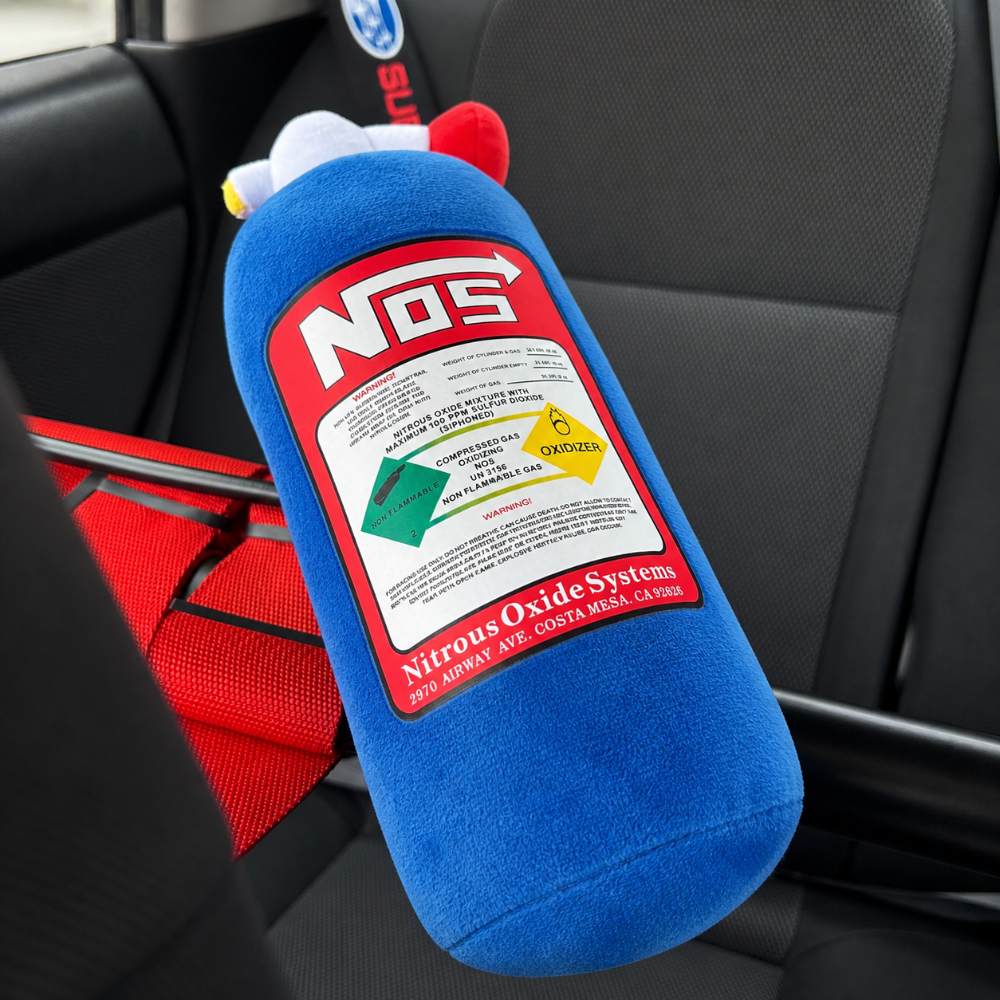 Blue NOS bottle cushion with strap fitted to seat in Subaru WRX – Motorev interior accessory