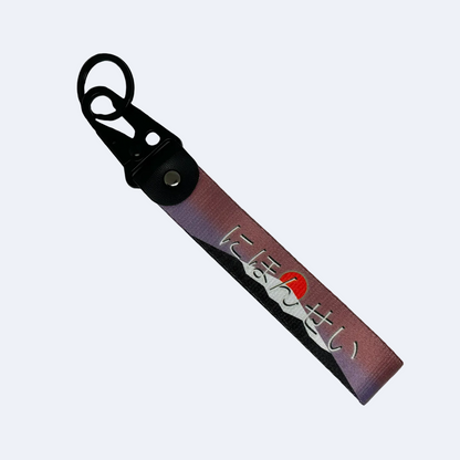 JDM key tag with an image of a mount fuji sunrise and Japanese text – Motorev performance car keychain
