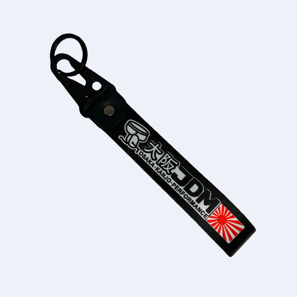 Black key tag with Japanese print, a sunrise logo and he test "JDM" – Motorev embroidered car keychain