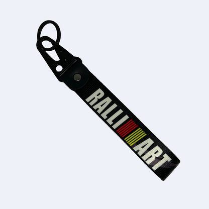 Black key tag with RALLIART branding – Motorev performance keychain for car enthusiasts