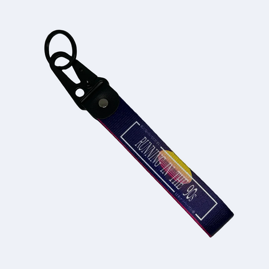 Purple key tag with a 90's sunset aesthetic and text that reads "Running In The 90's" – Motorev performance car keychain