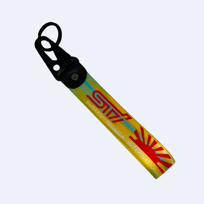 Yellow key tag with the Subaru WRX STI logo and Japanese rising sun – Motorev automotive keychain