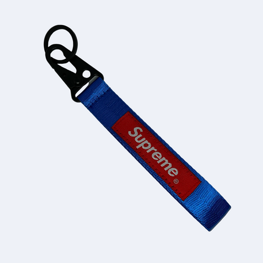 Blue Supreme style key tag with bold logo text – Motorev JDM car keychain accessory